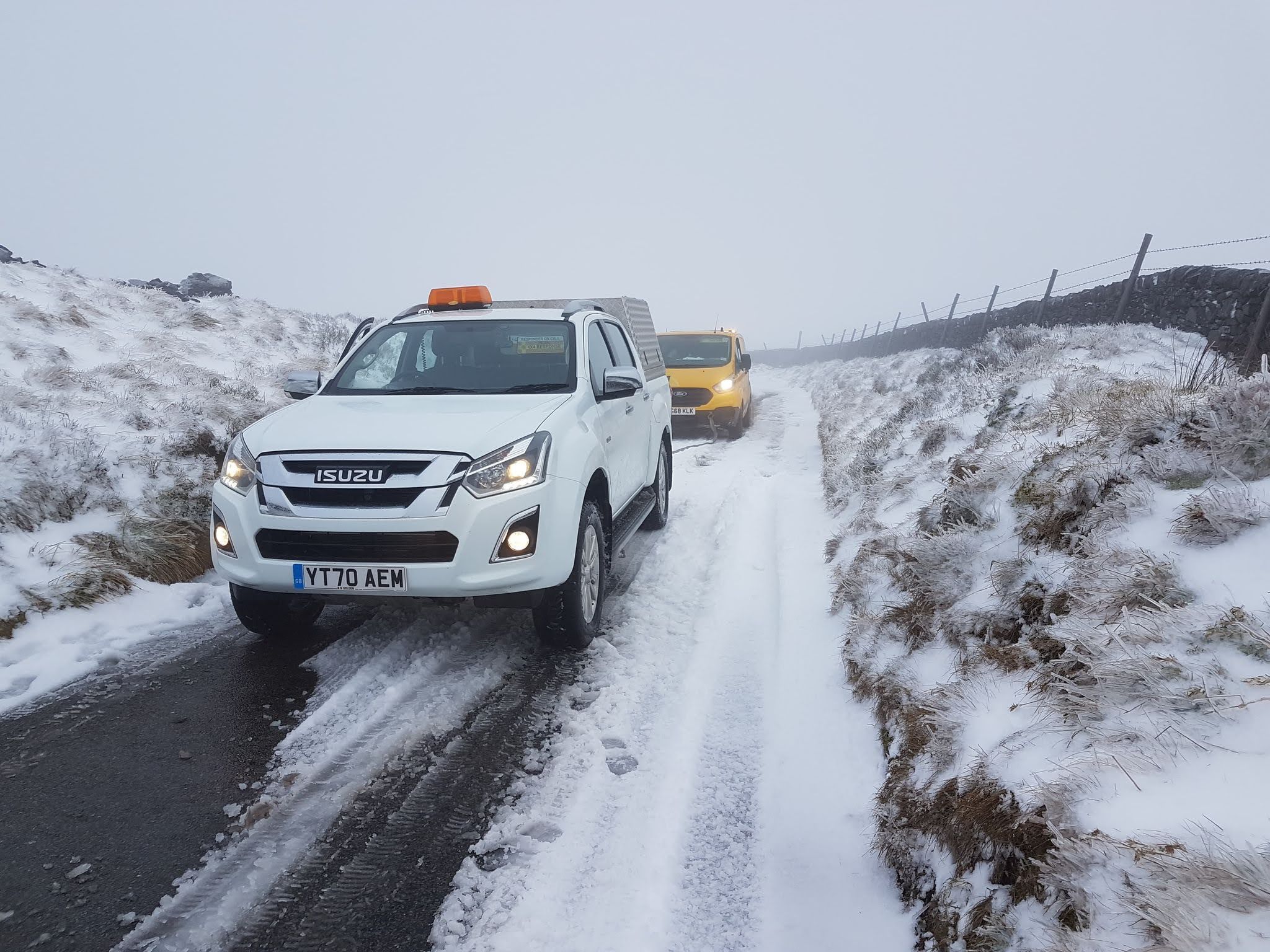 A Peak 4x4 responder recovering an AA van during a snow event
